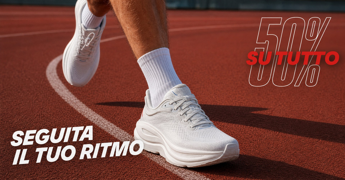 Runner con scarpe bianche senza loghi su pista